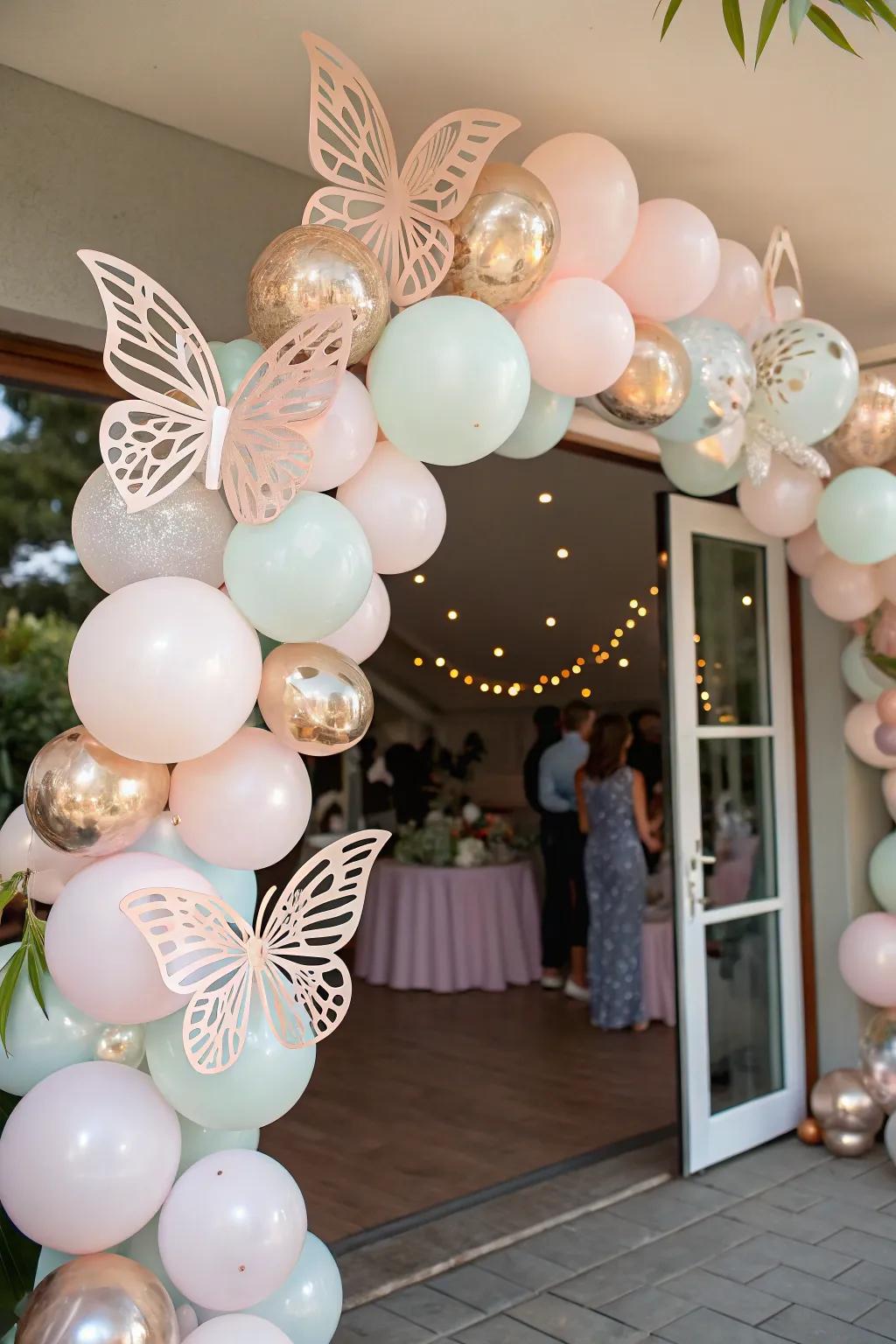 A fanciful balloon arch decorated with butterflies, greeting visitors to the festivity.