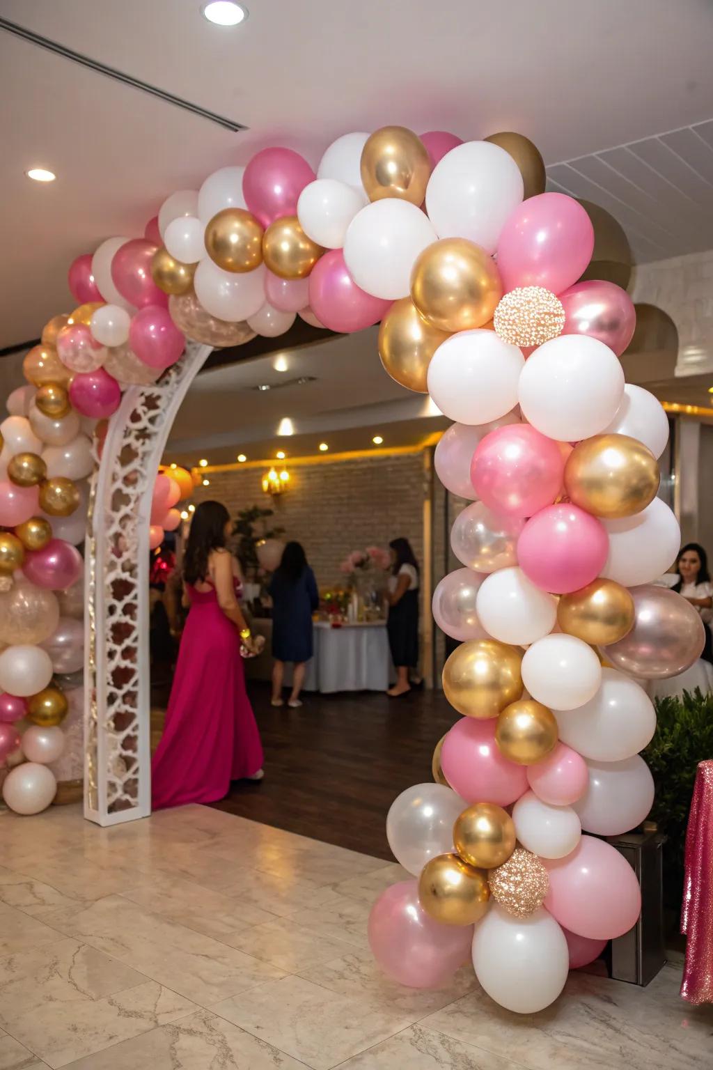 An eye-catching balloon arch featuring metallic rose, gold, and pearl hues.