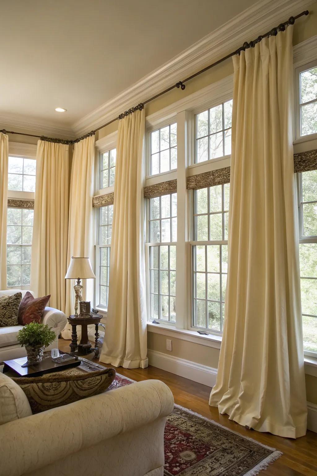 Coordinated drapes contribute a sensation of unity and sophistication to a space with numerous windows.