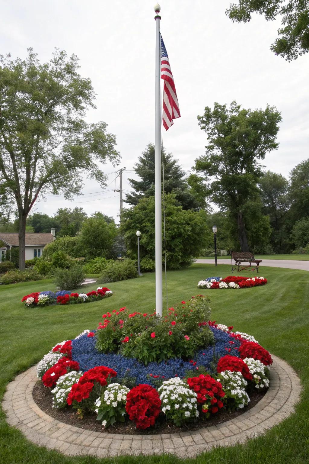 A vibrant, circular floral display encircles a flagpole, honoring national pride.