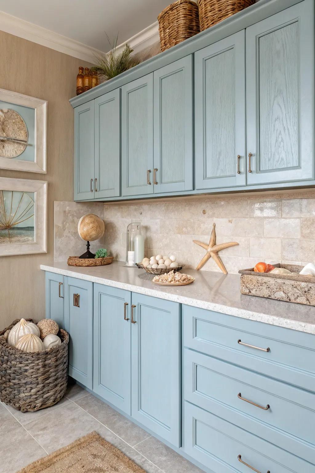 A kitchen that takes inspiration from the coastal palette, showcasing gentle blues and sandy tans.