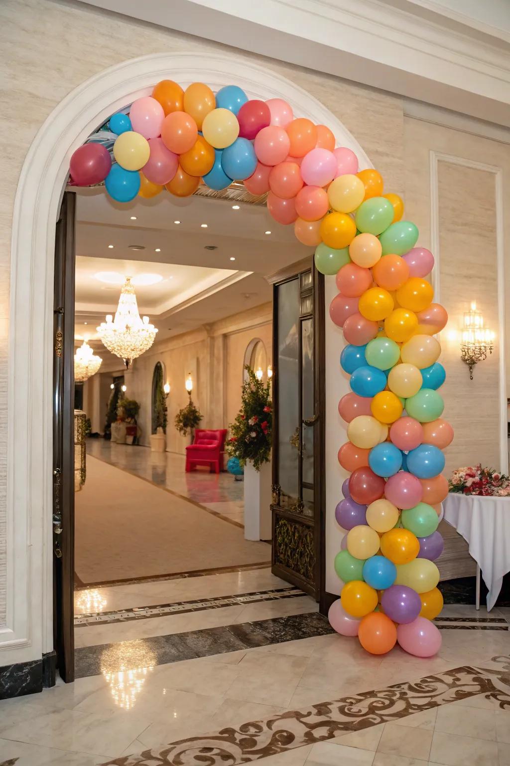 A lively balloon arch highlights a chic entryway, employing various sizes and hues for a dynamic visual.