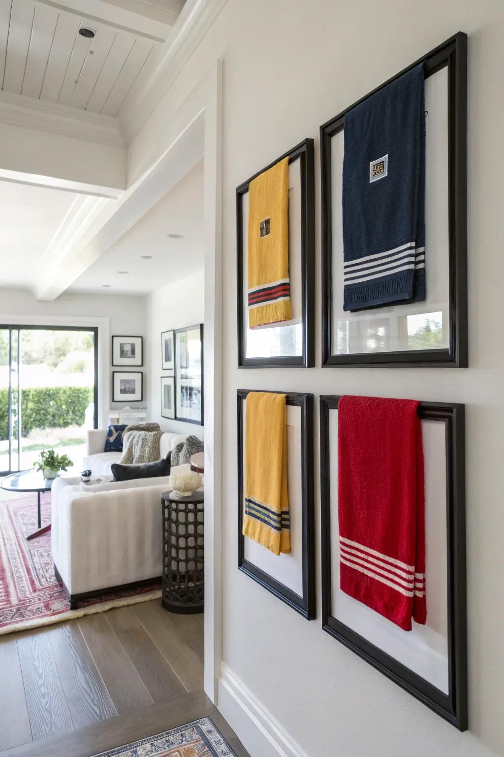 Showcasing <strong><em>rally towels</em></strong> in frames creates compelling pieces of wall decor.” loading=”lazy” class=”pimg”>
	</picture><figcaption>Showcasing <strong><em>rally towels</em></strong> in frames creates compelling pieces of wall decor.</figcaption></figure>
<p>Placing your <strong><em>rally towels</em></strong> in frames transforms them into captivating artworks, infusing any space with lively hues and team pride. I’m particularly fond of using streamlined ebony frames, which create a stunning juxtaposition against the towels’ vivid colors.</p>
<h3>A few things you might like:</h3>
<ul class=