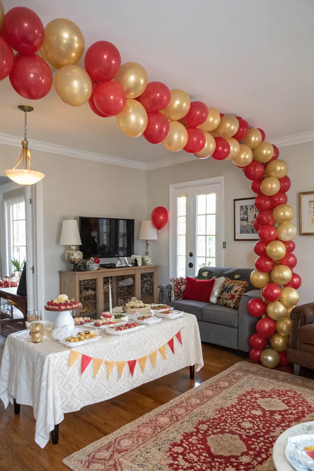 A magnificent scarlet and gilded balloon arrangement offers a festive welcome.