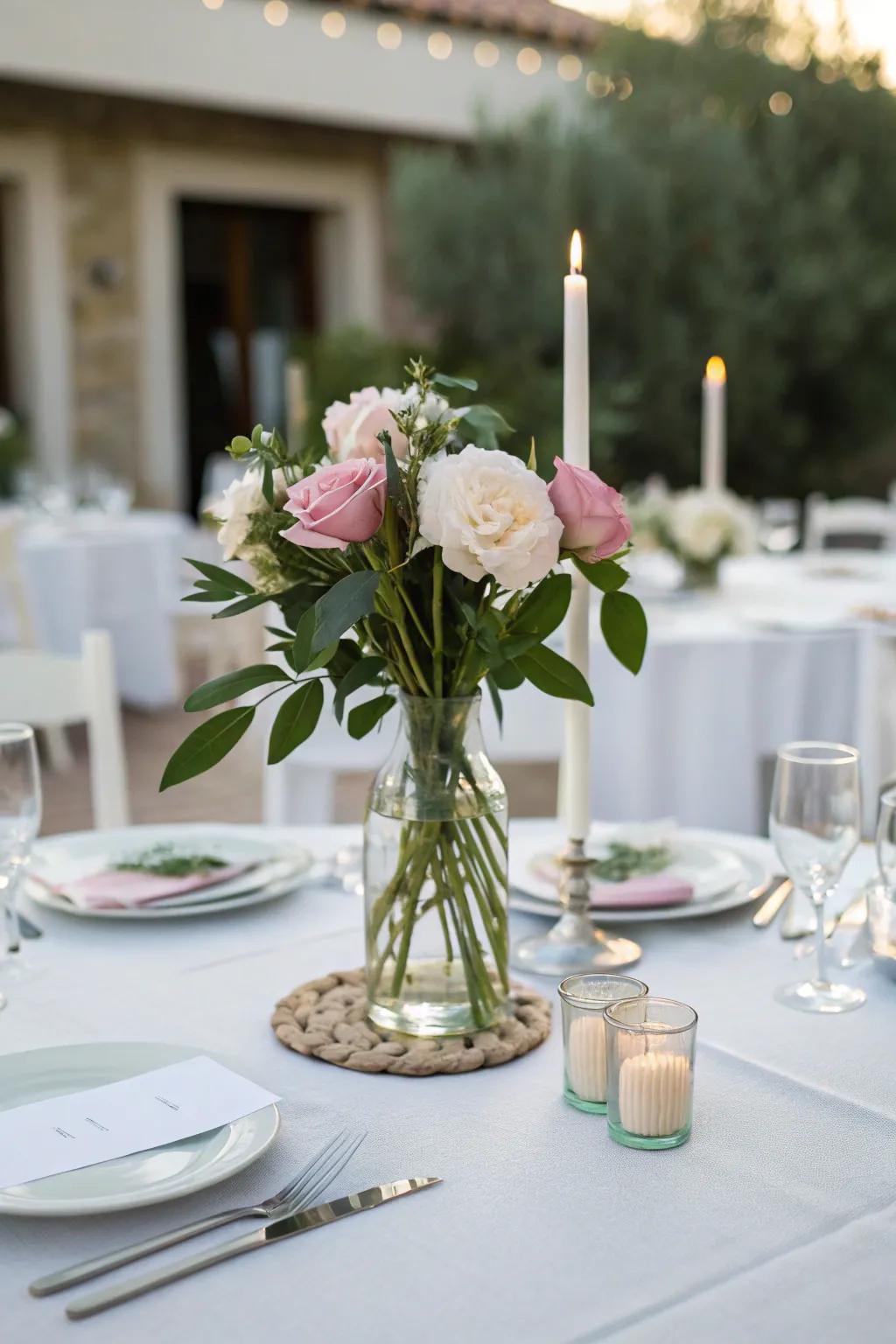 A simple vase with posies contributes refinement to the table design.