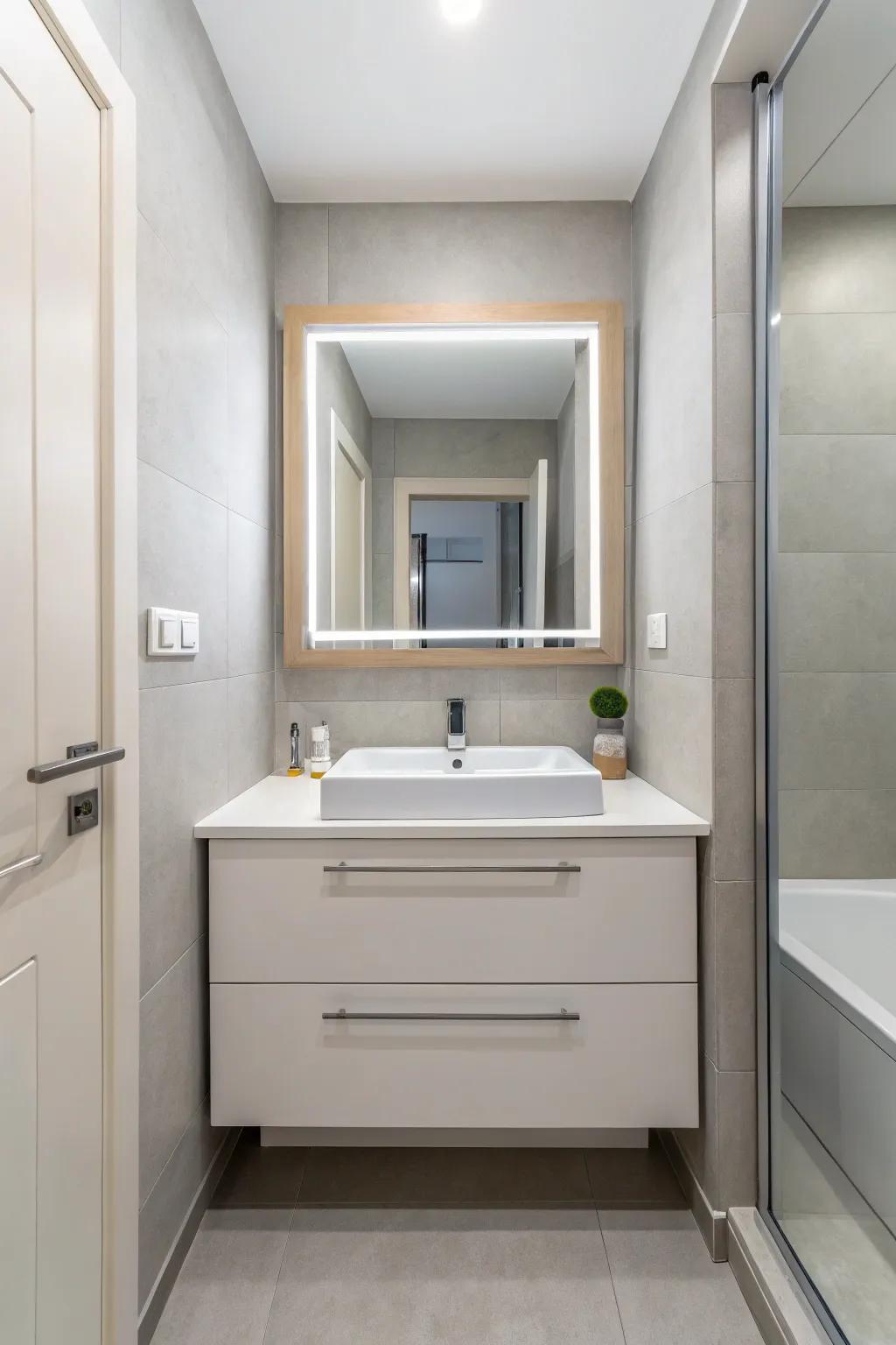 A compact, contemporary bathroom featuring a wall-hung vanity to maximize space.