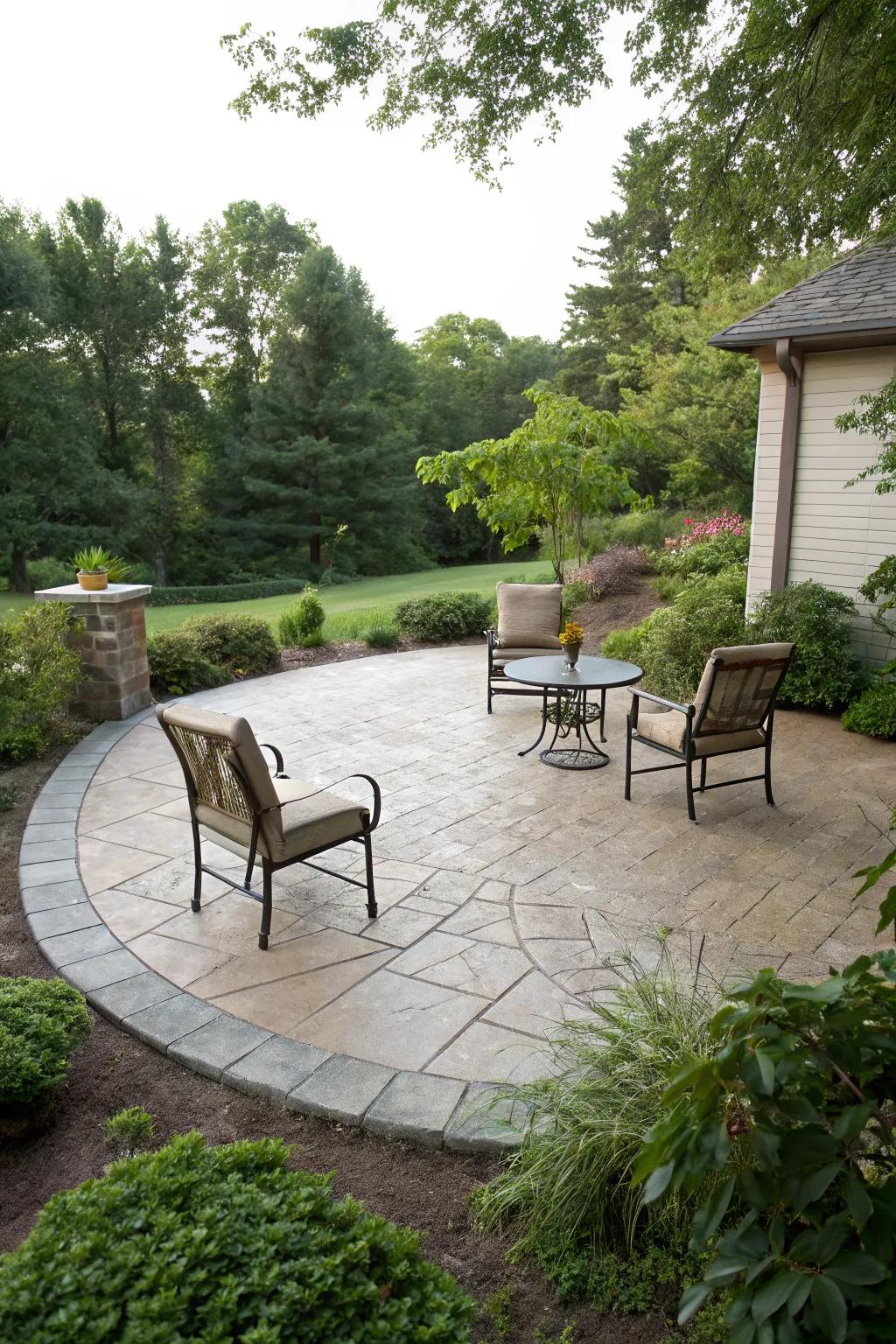 A circular stamped concrete patio presents an intimate, cozy space.