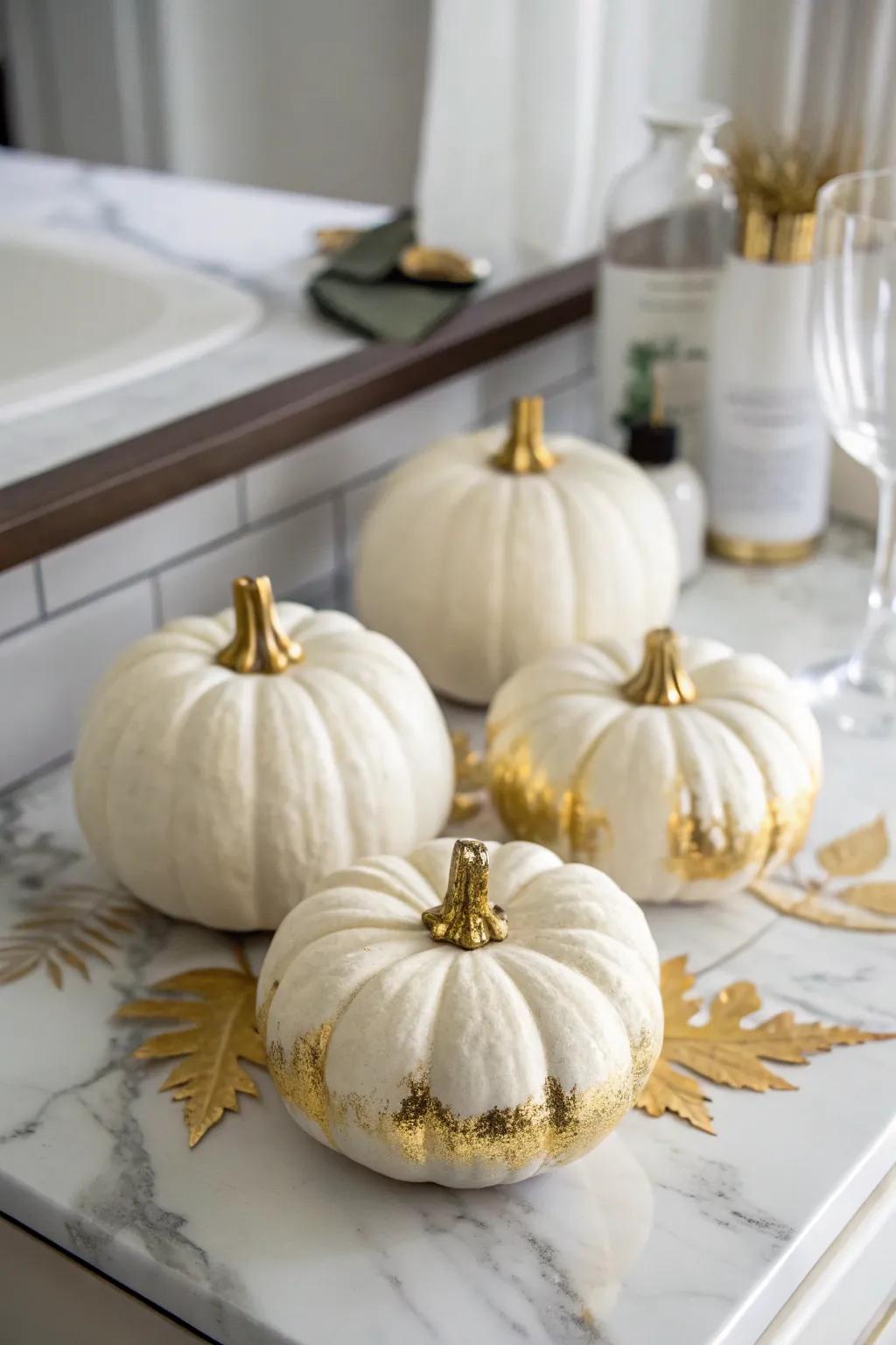 White pumpkins enhanced with gold for a luxurious touch.