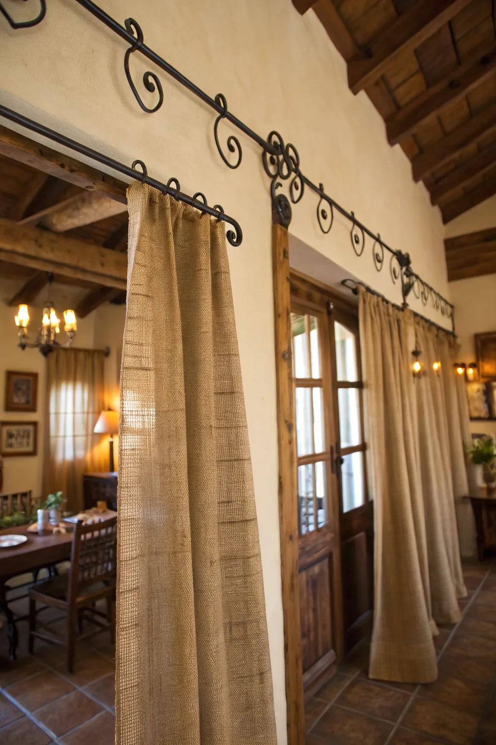 Countryside elegance featuring hessian drapes and wrought iron rods.