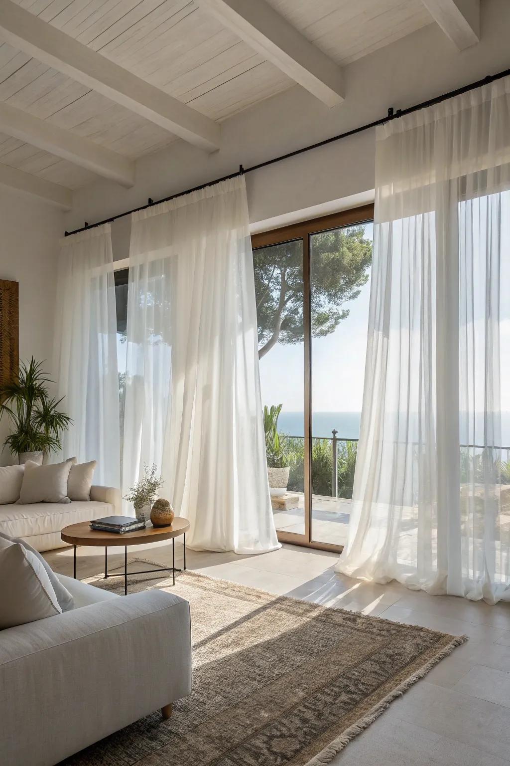 Sheer window coverings create a breezy, coastal impression.