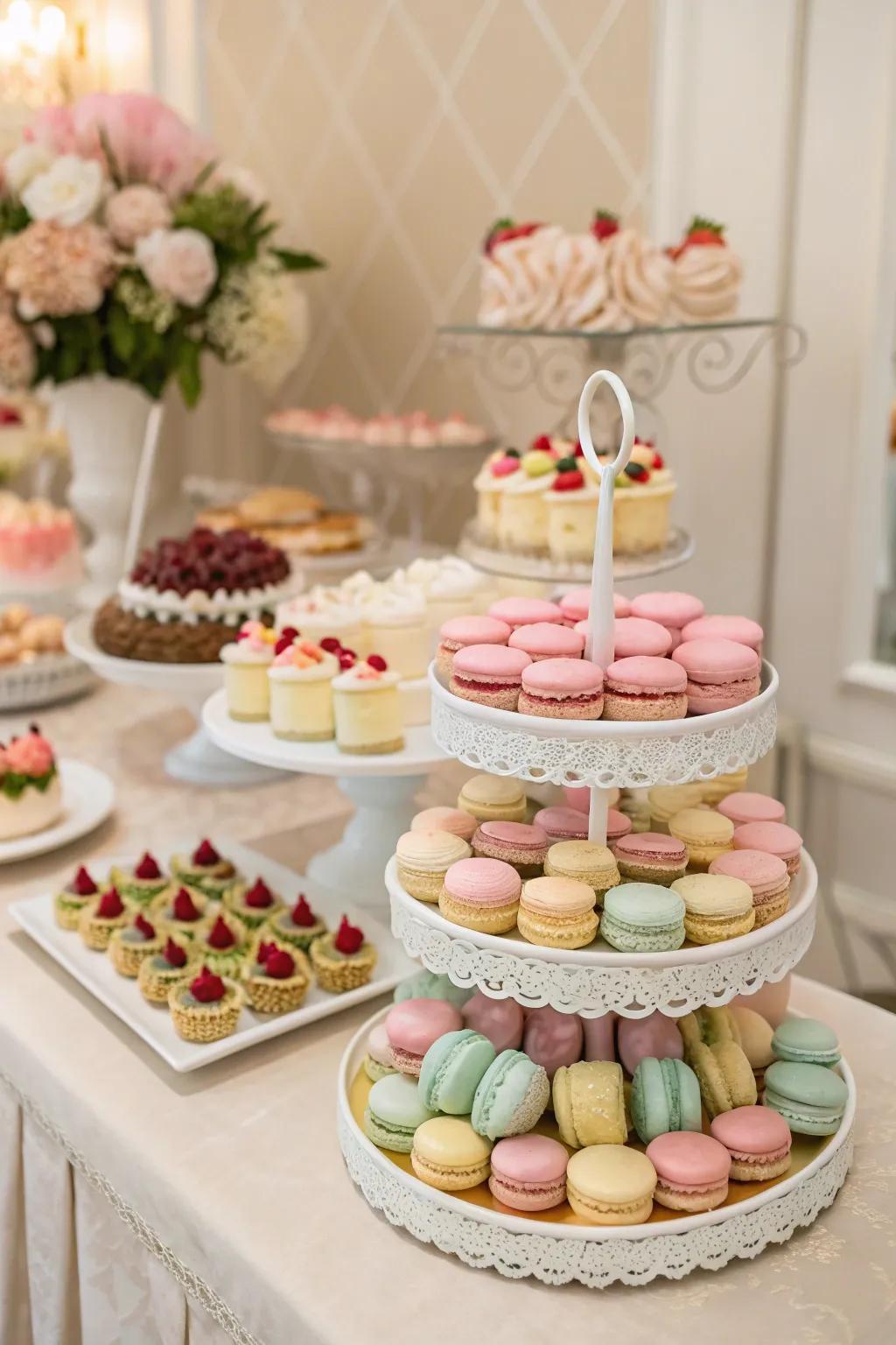A wedding treat station displaying light-colored macarons and miniature carrot treats.