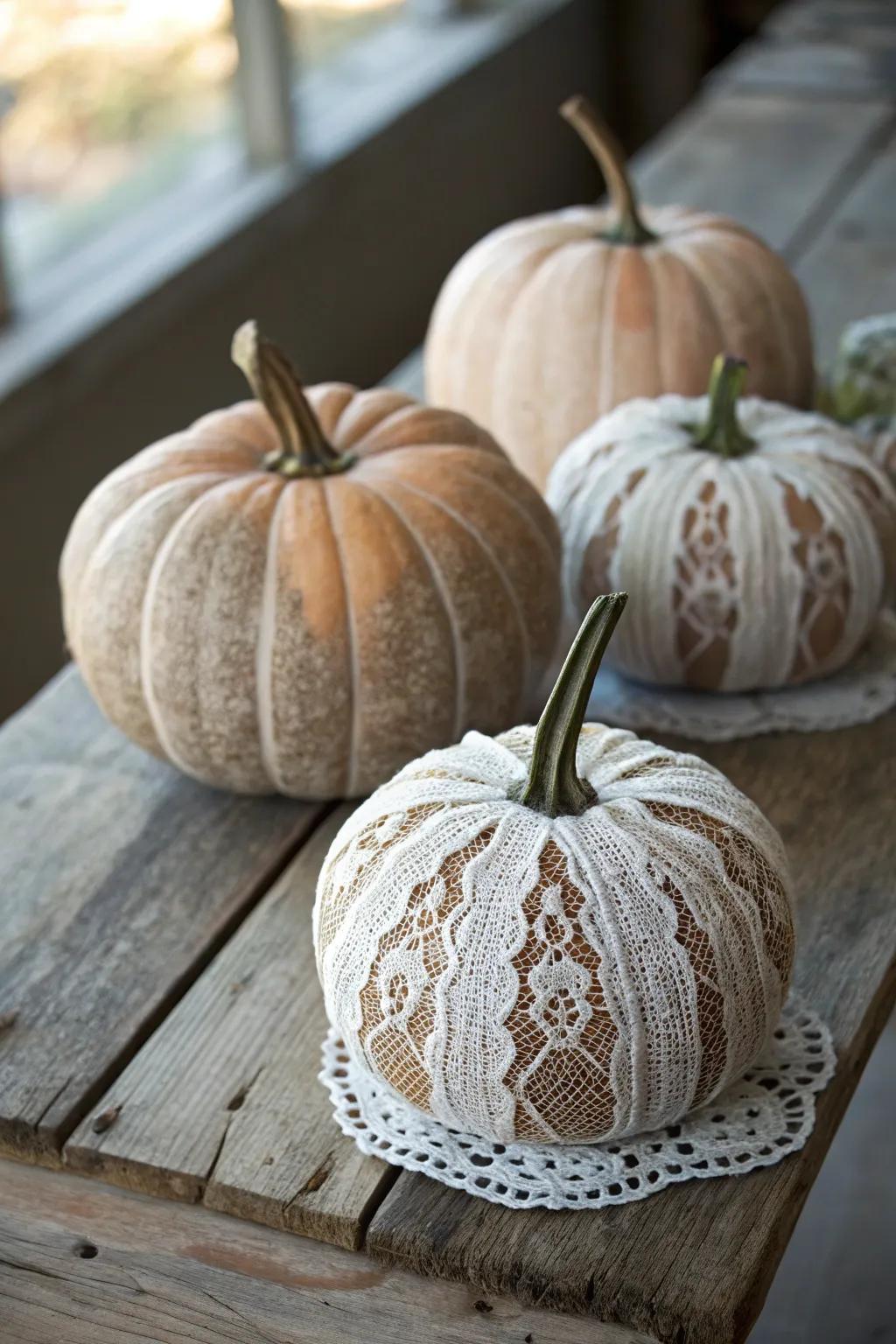 Lace-wrapped pumpkins bring vintage elegance to autumn decor.