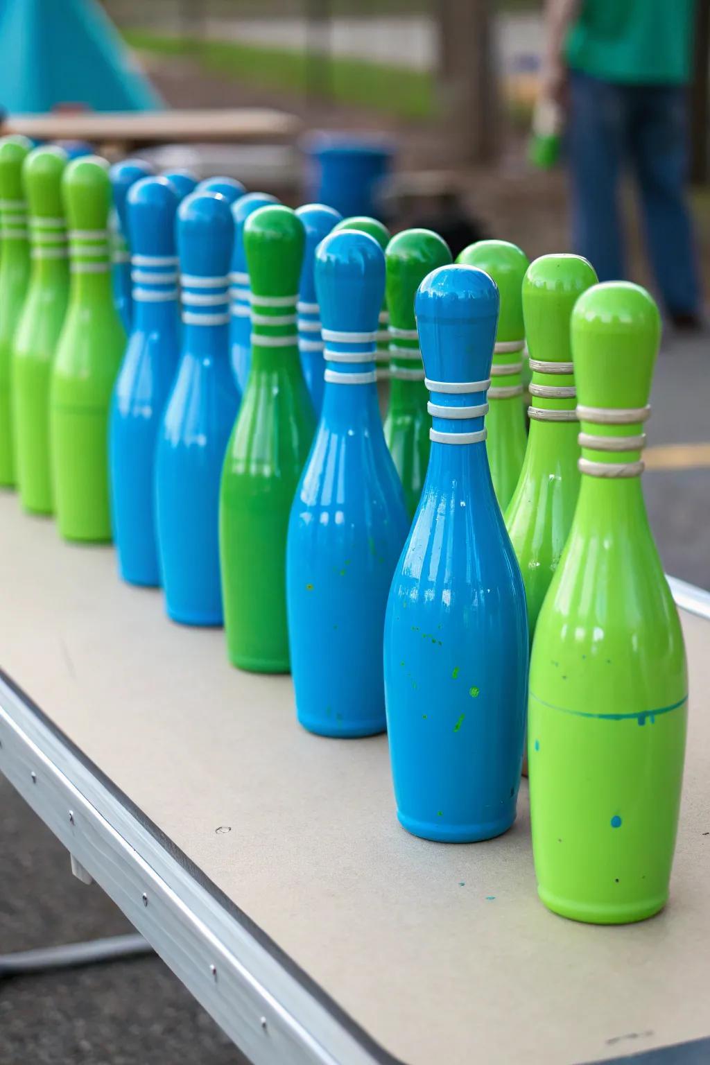Crafty DIY spray-painted bottles for a distinctive bowling centerpiece.
