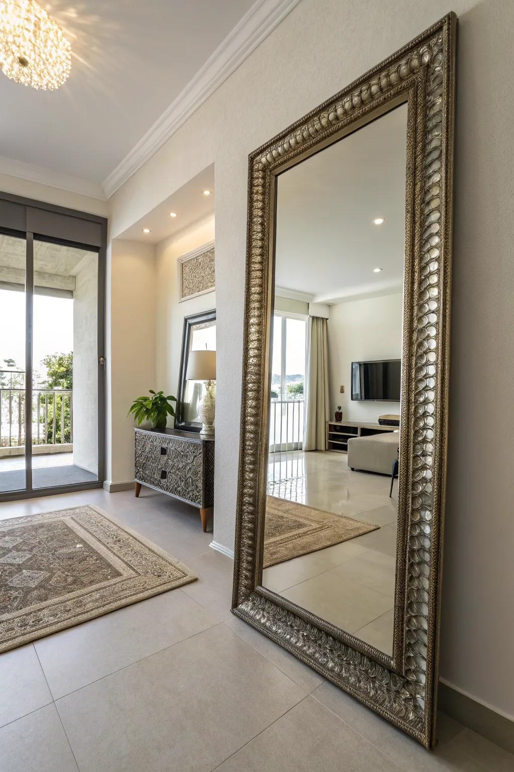 A condo featuring a large decorative mirror that reflects light, creating a spacious effect.