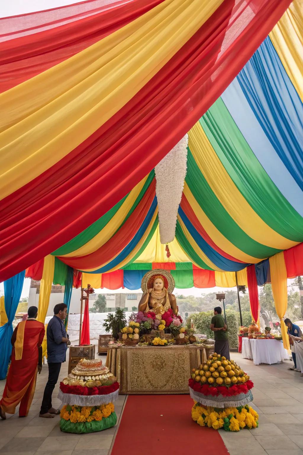 Dramatic and colorful textile creating a canopy above the Ganesh Chaturthi setup.