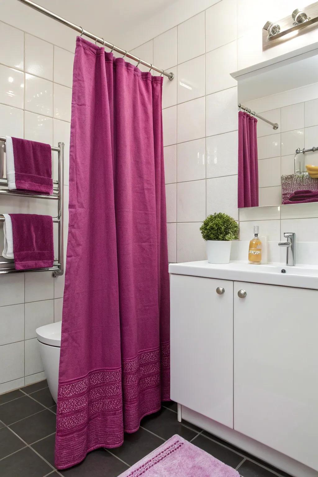 Fuchsia accents bring a lively touch to this modern bathing area.