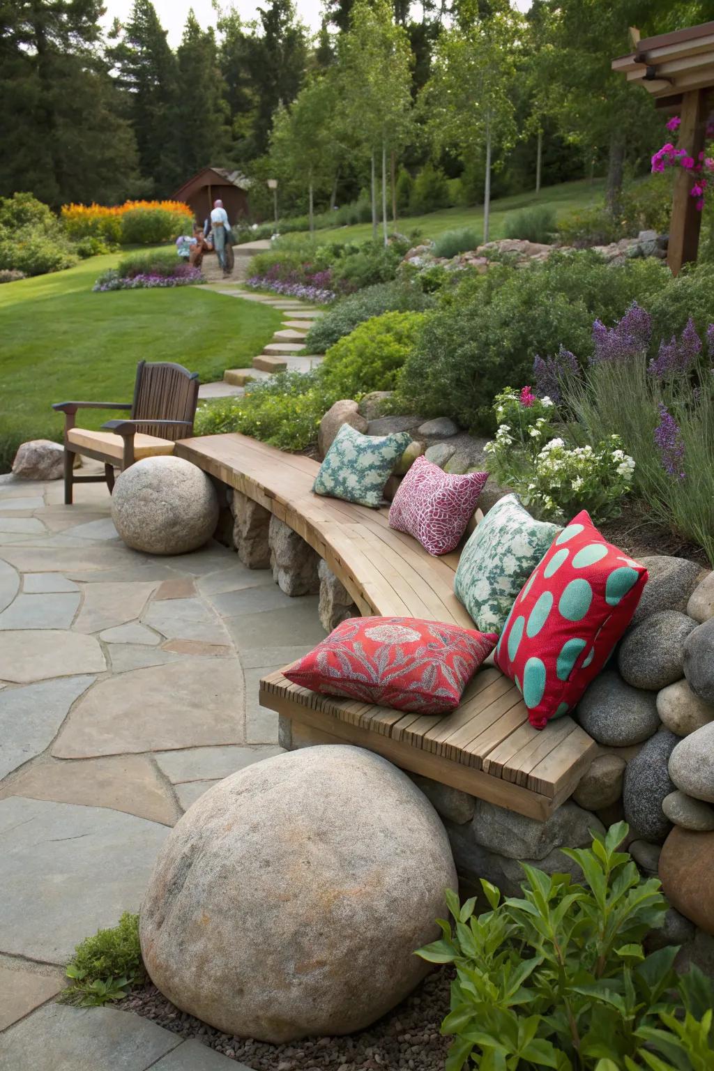 Sizable river stones compose a cozy and imaginative seating zone within this garden.