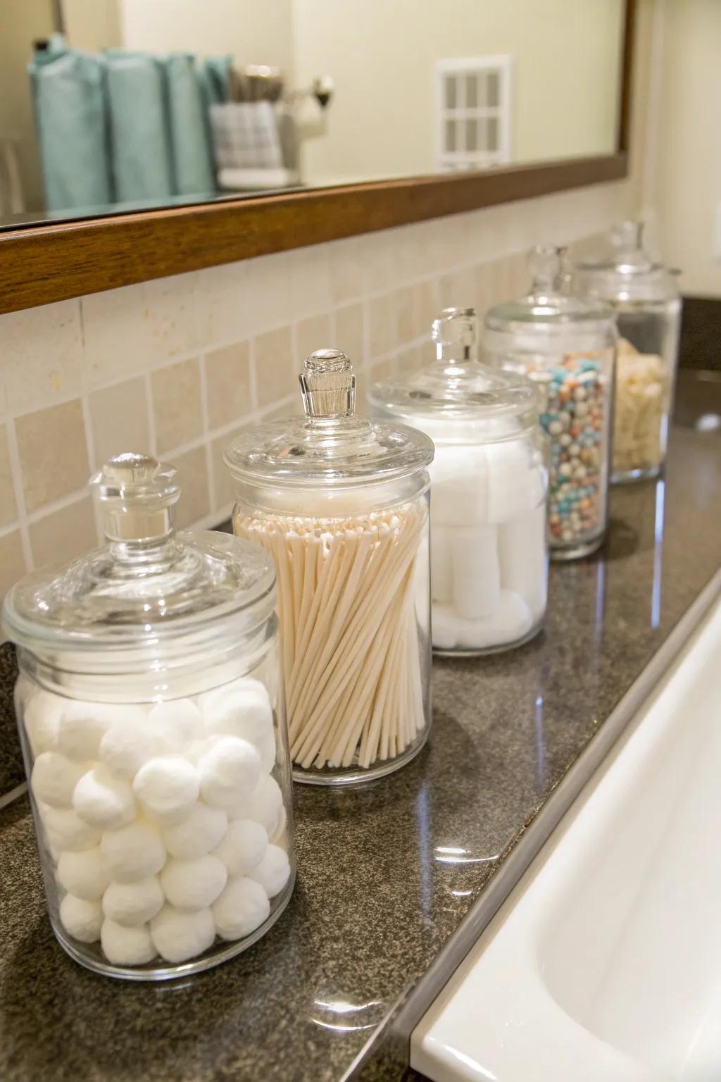 Crystal jars are a classy way of storing little bathroom must-haves.
