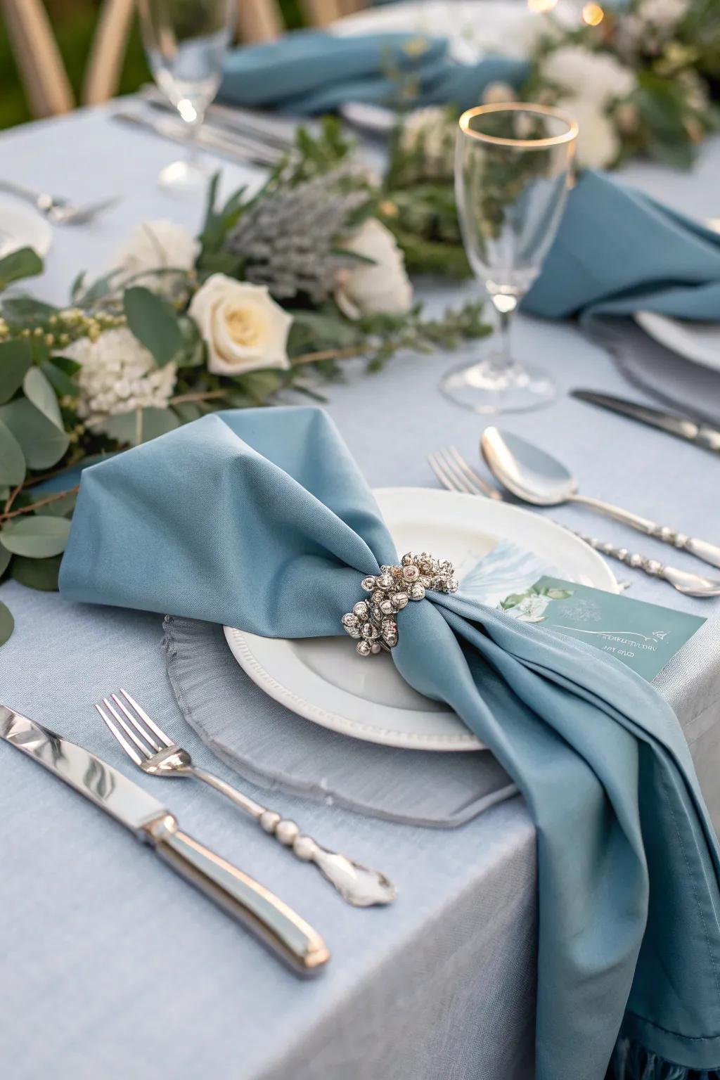 A refined table arrangement featuring misty blue cloths that enhance the dining experience.