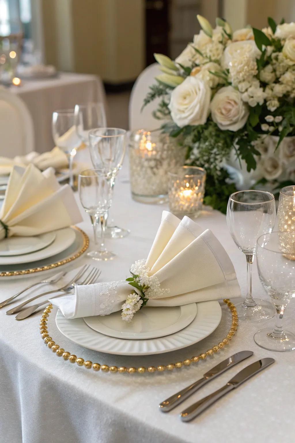Sophisticated napkin art imparts a subtle impression to the setting.
