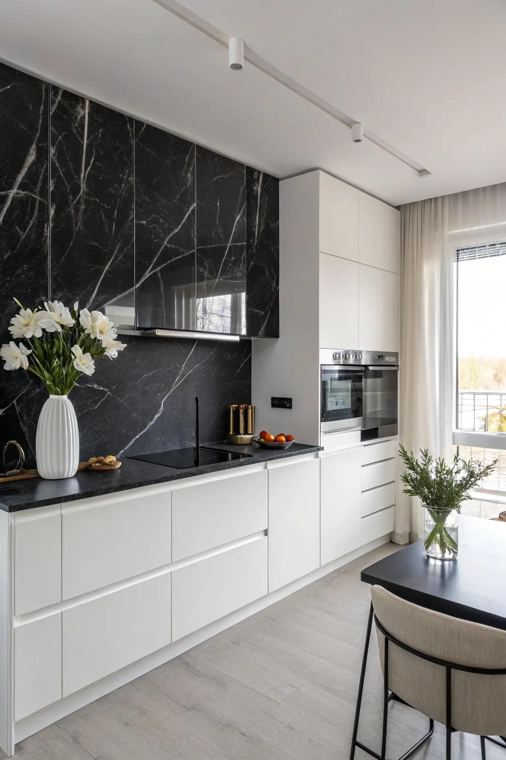 A kitchen design with a luxurious black marble backsplash and minimalist design elements.