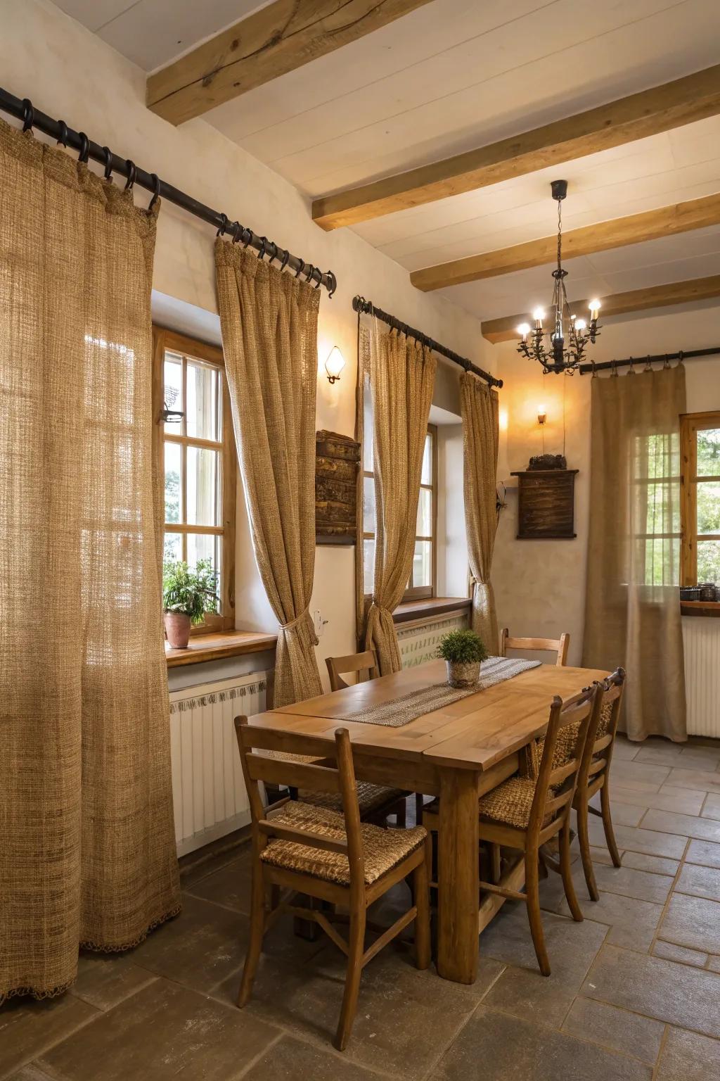 Roughspun draperies incorporating rustic allure into a farmhouse-inspired dining area.