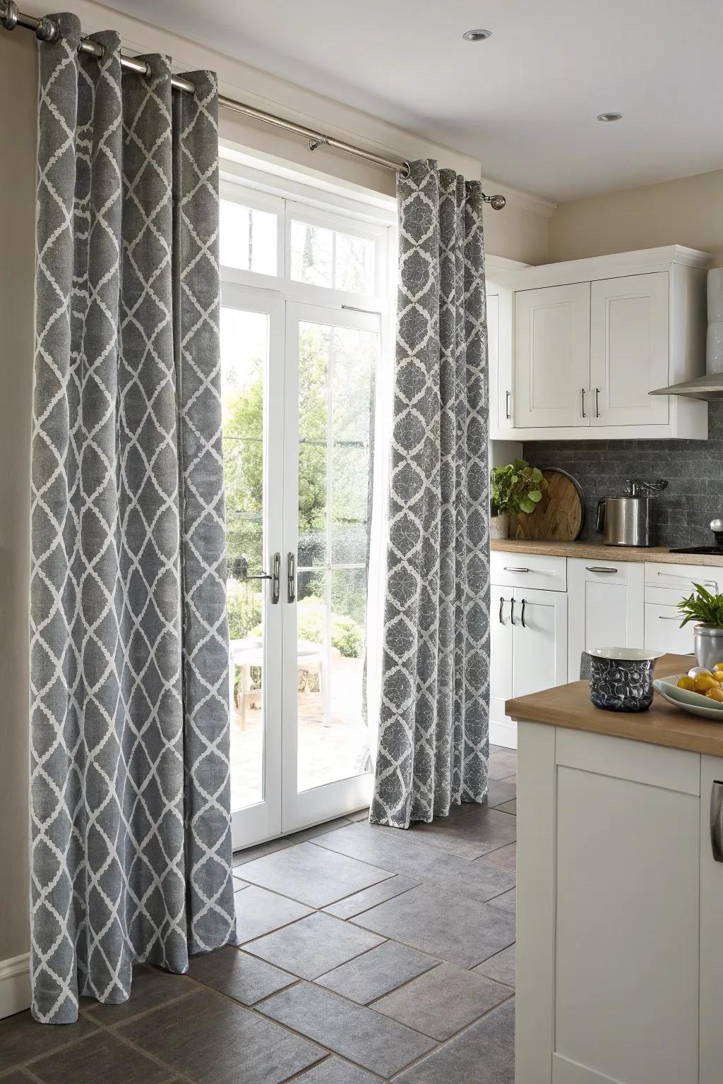 Audacious shaped decorated gray drapes for a contemporary art-inspired kitchen.