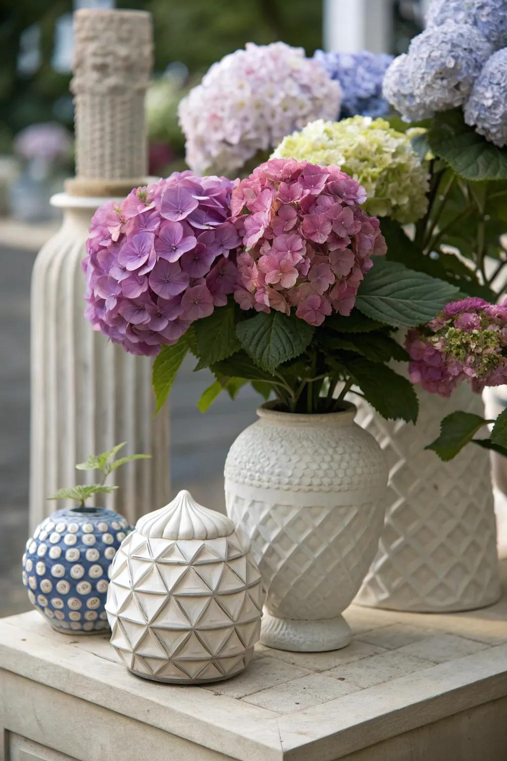 Artistic setup of hydrangeas with sculptural elements.