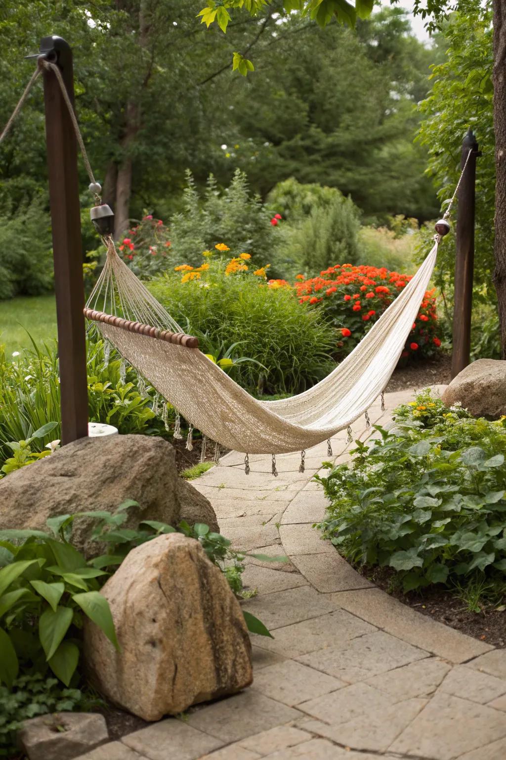 A cozy hammock supported by sturdy stone anchors in a garden.