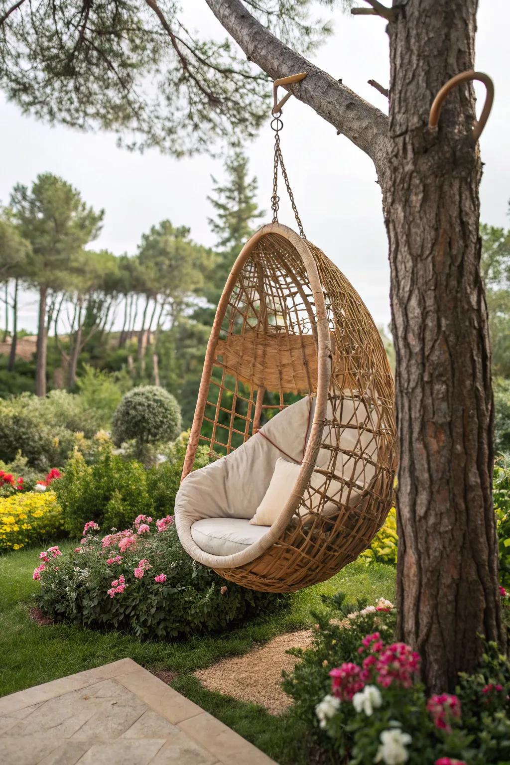 A rattan cocoon swing furnishes a snug garden retreat.