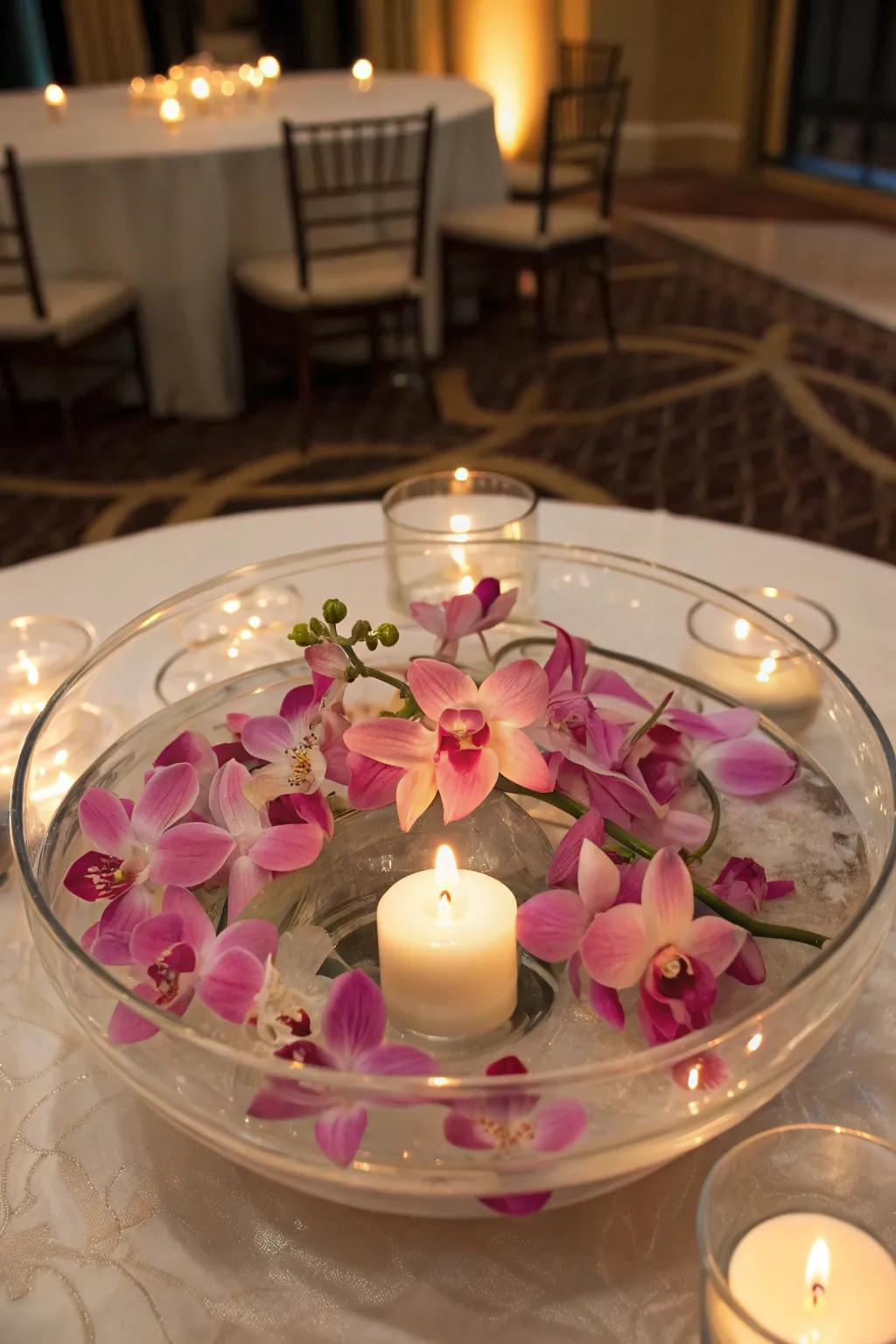 Drifting flower centerpiece with orchids and lights