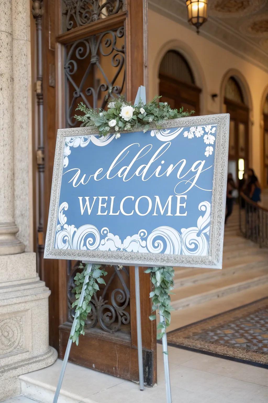 Stylish wedding signage featuring misty blue accents, welcoming attendees with elegance.