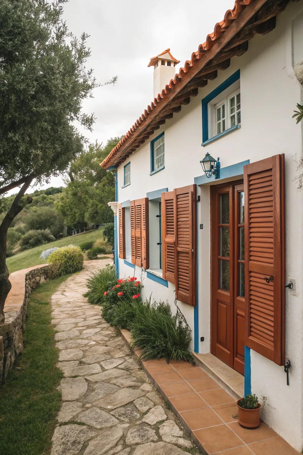 Mediterranean-style house featuring terracotta blinds.