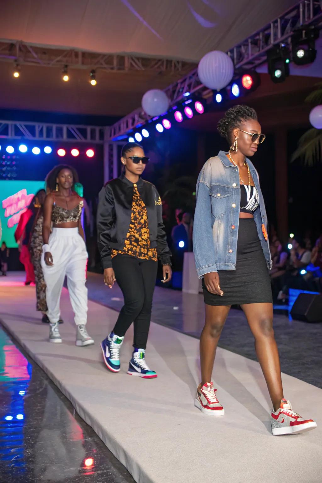 Guests showing off their unique sneaker styles in a fashion presentation.