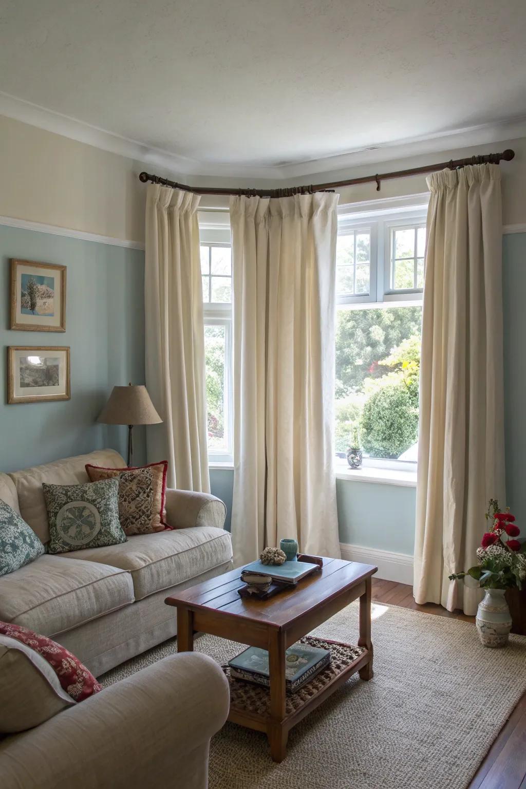 High-hung window coverings add verticality to this small living space.