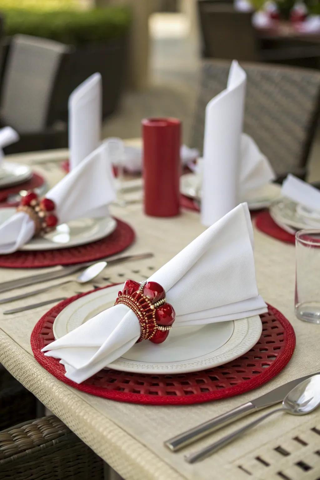 Elegant scarlet serviette bands contributing refinement to the table.