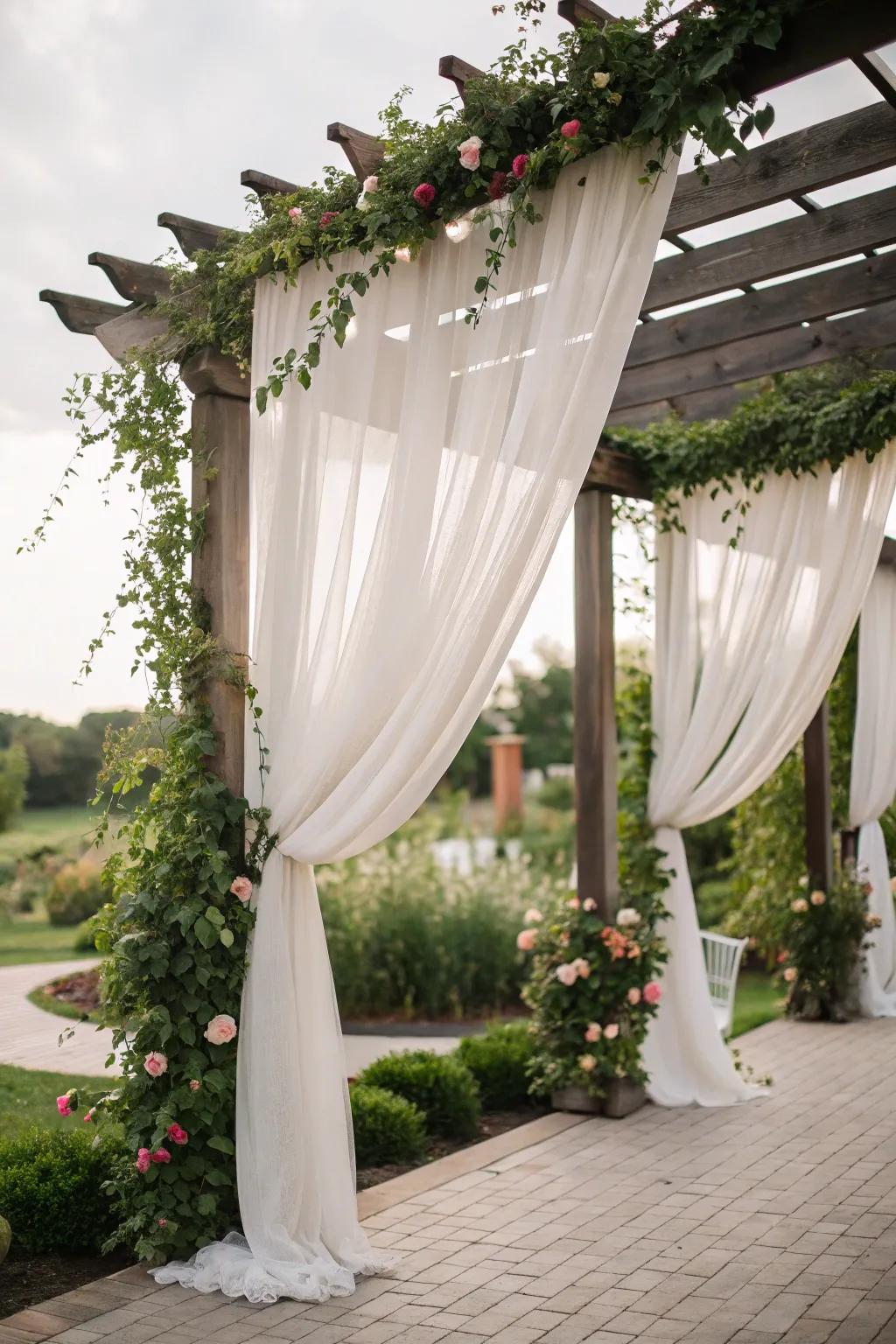Drapes add romance and seclusion to the pergola.