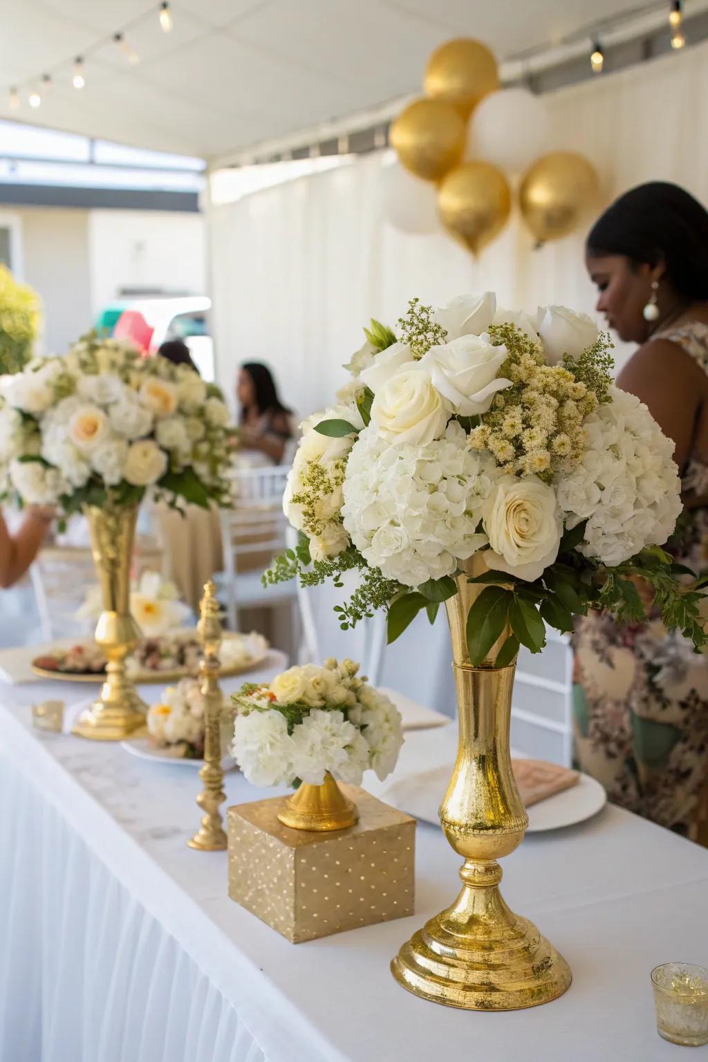 Stylish gold and white flower arrangements for added elegance.