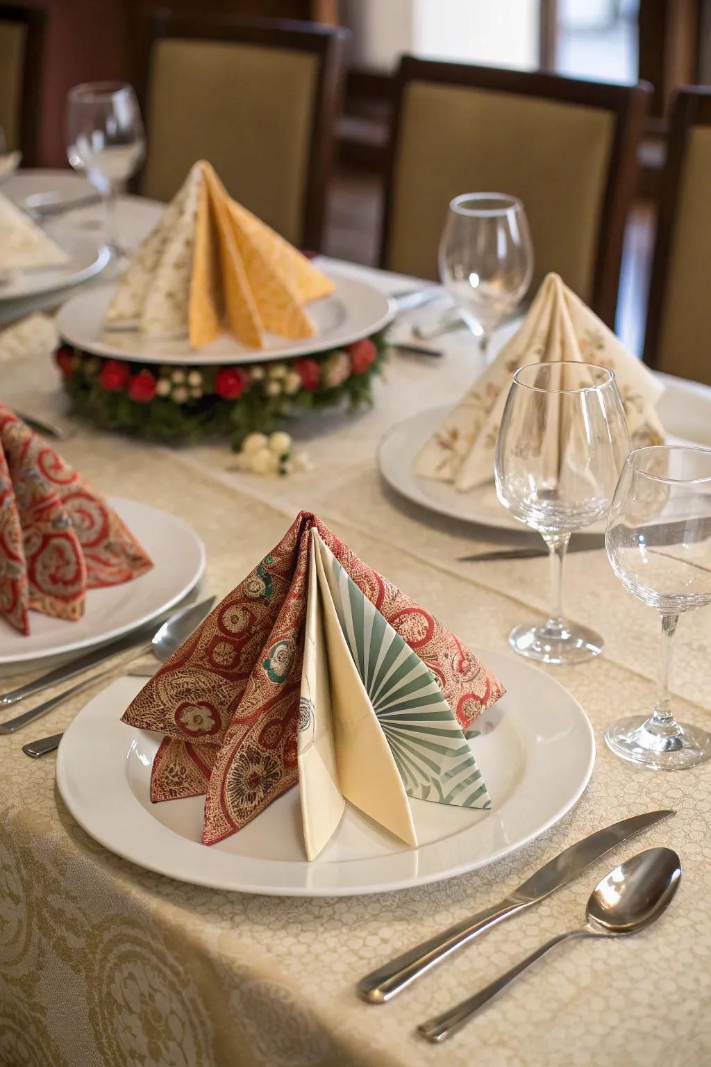 Sophisticated paper folding pliages produce a distinctive table arrangement.