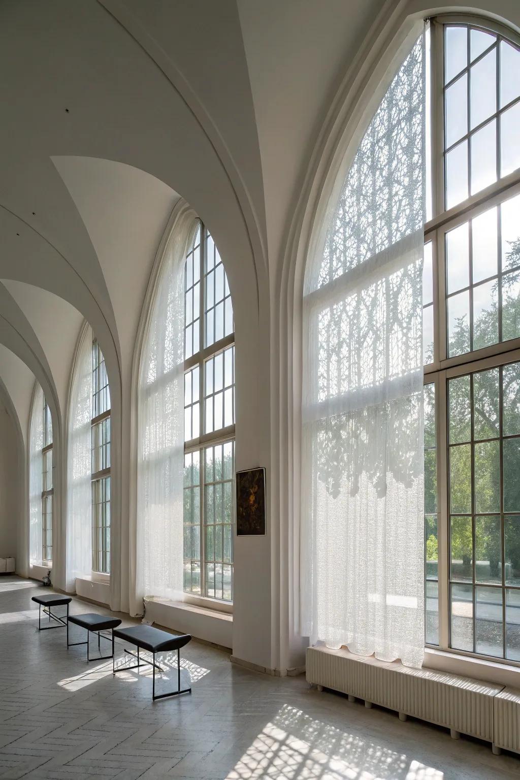 A modern minimalist space showcasing opaque panels on arched windows.