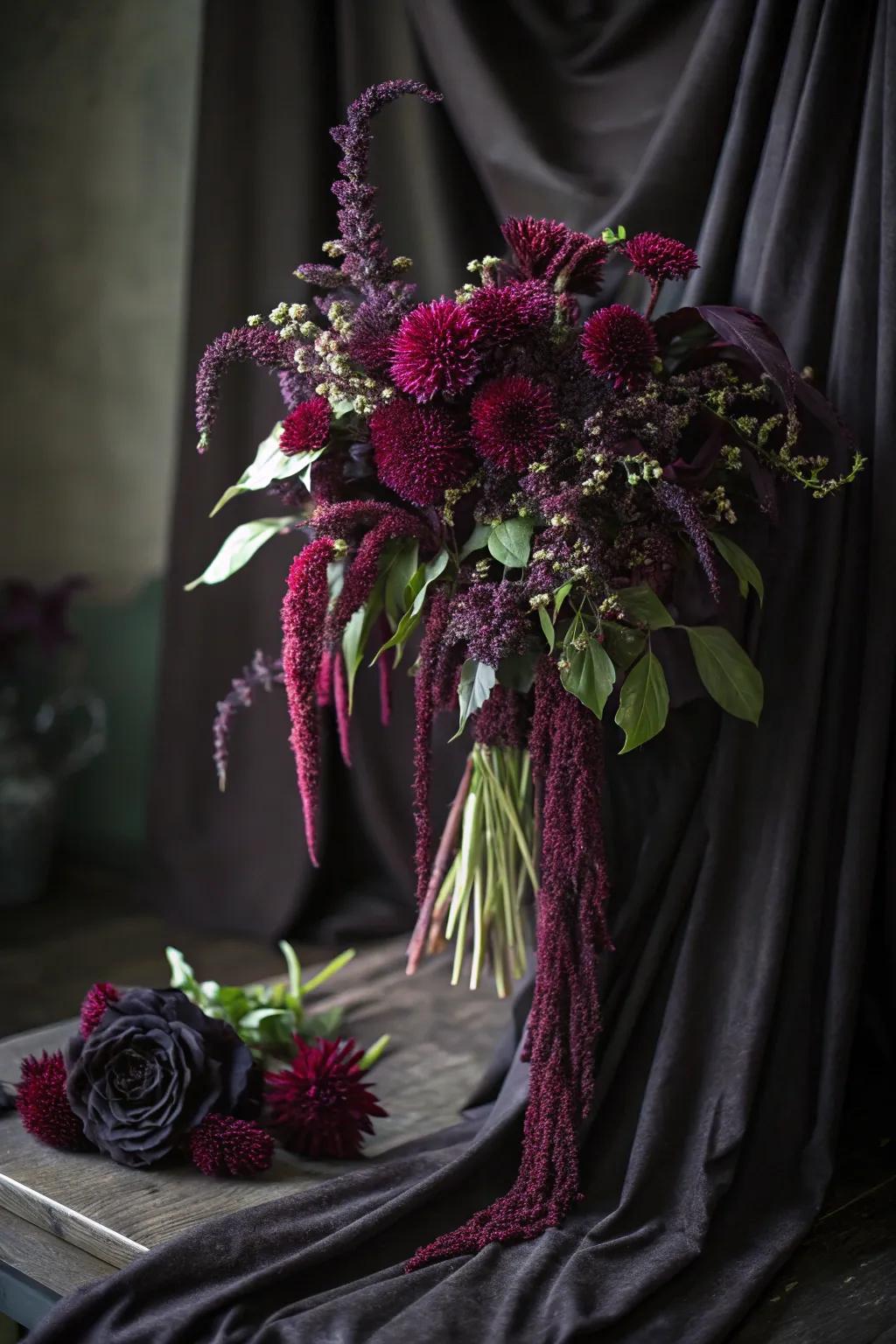 Amaranthus provides a cascade of color and mystery to this captivating Halloween bouquet.