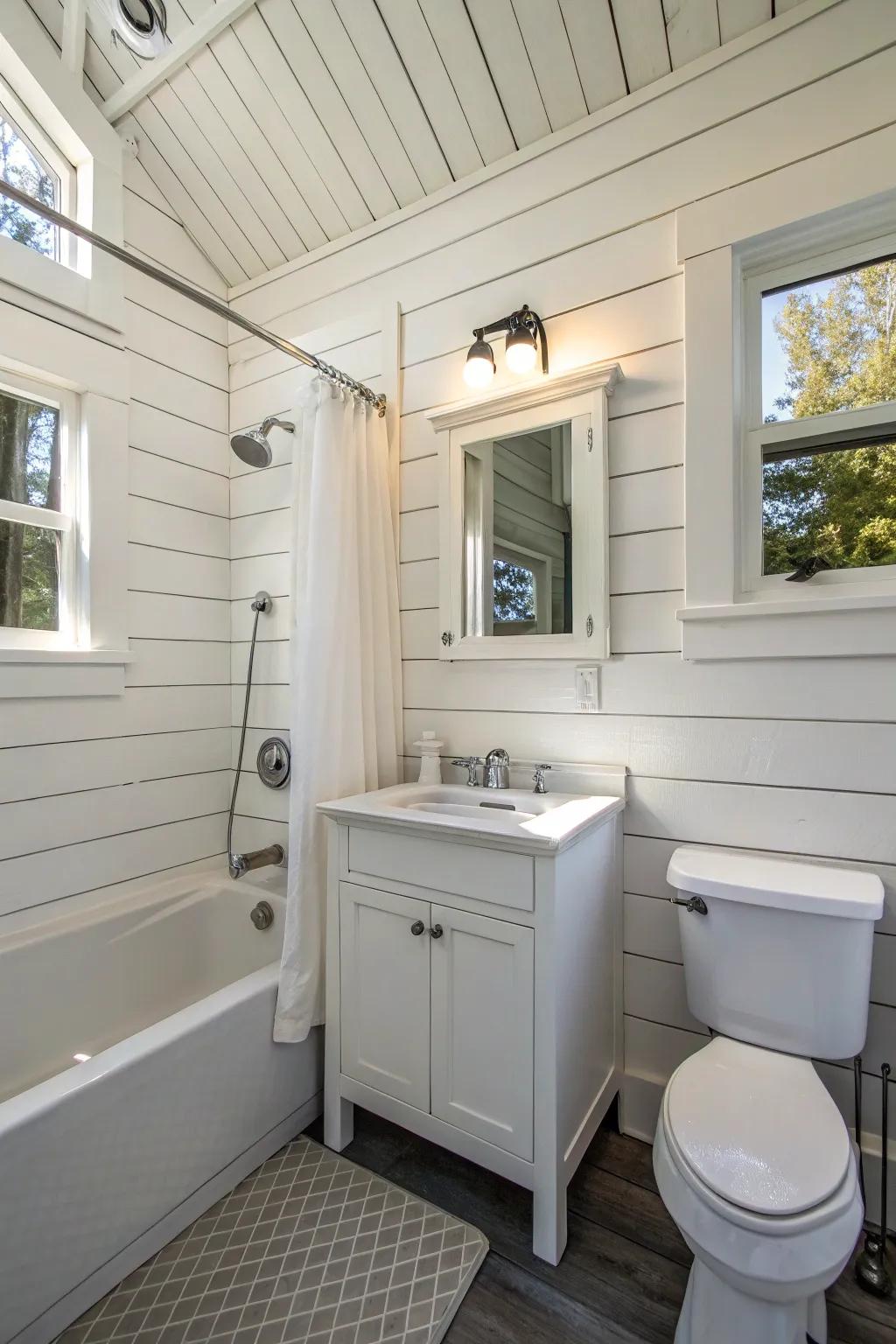 A small bathroom featuring white wall planks for added charm.