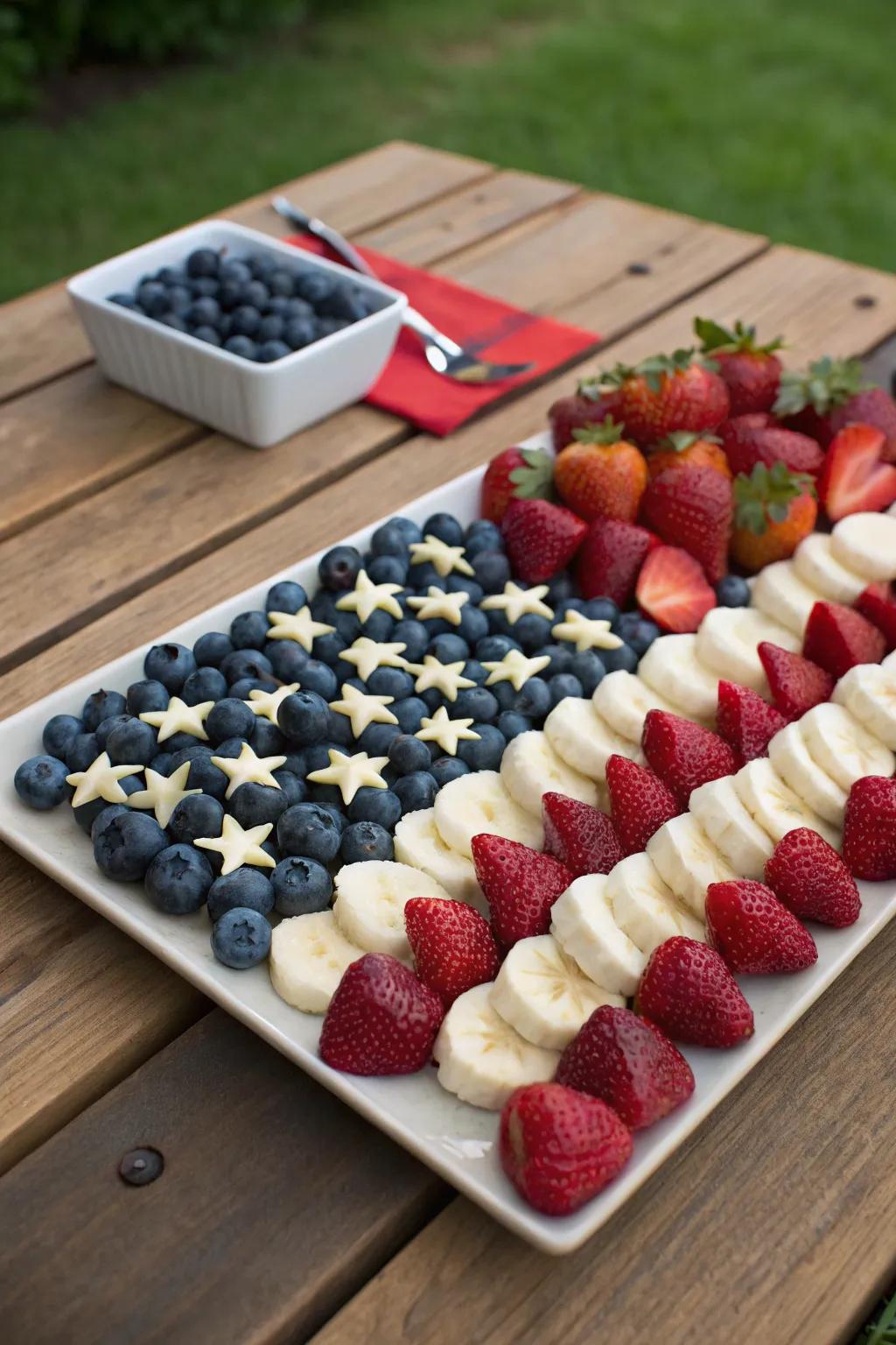 A fruit platter designed to look like the American flag, perfect for a 4th of July picnic.