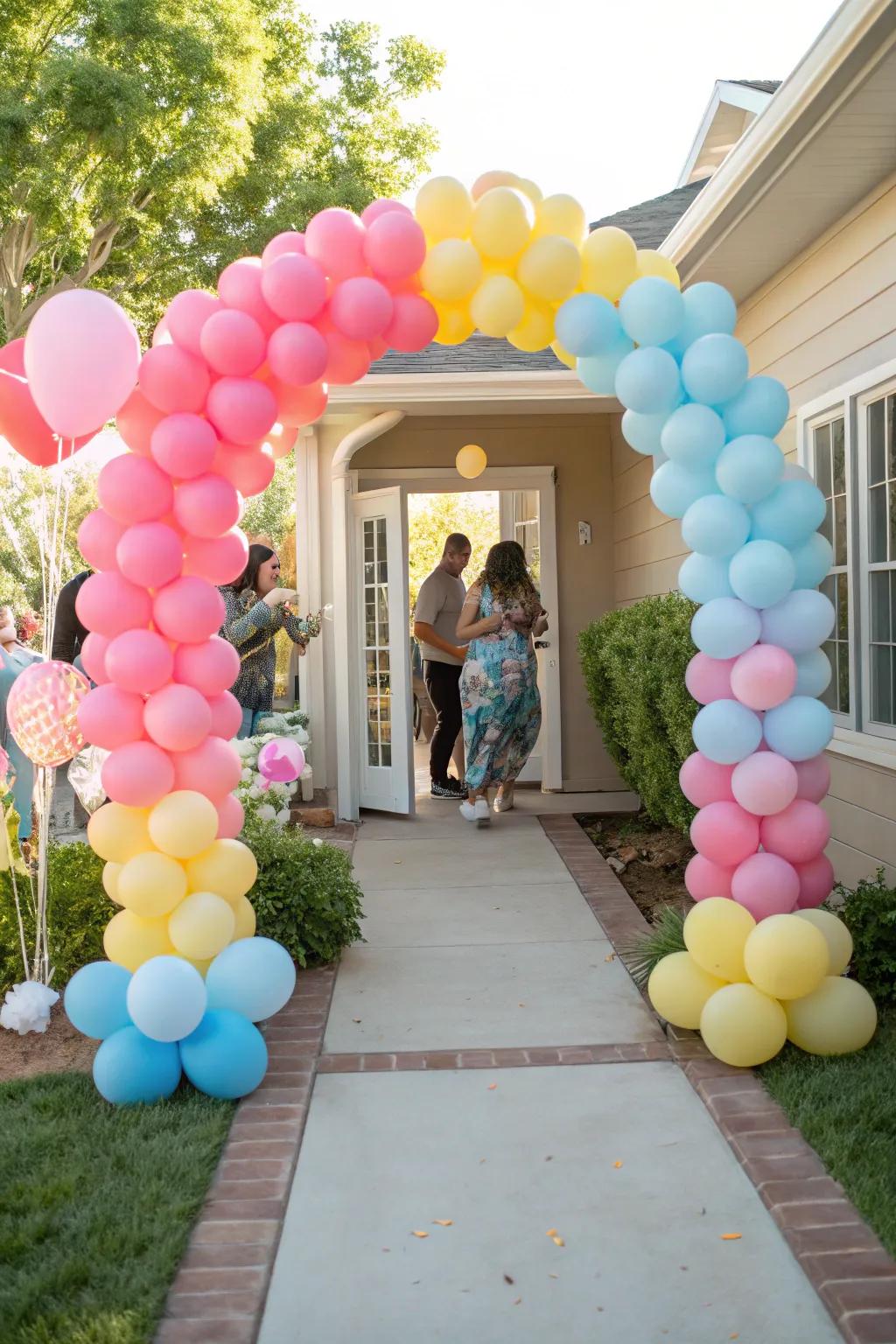 A cheerful balloon archway fills the baby shower entrance with colour and joy.