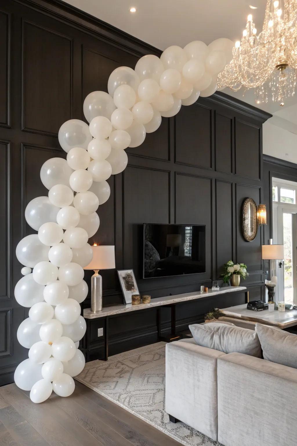 An elegant white balloon garland adding to a chic environment.