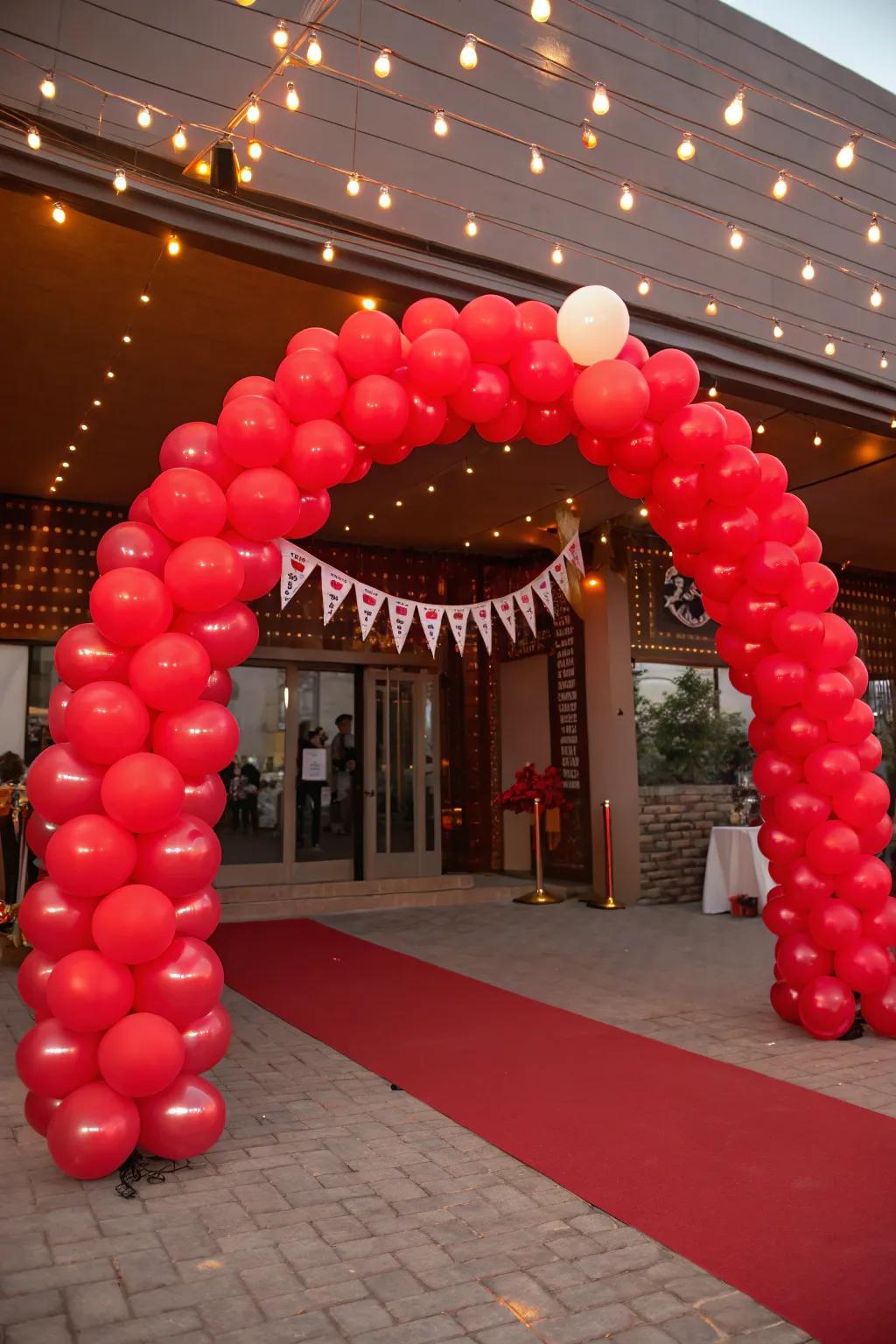 A ruby balloon arch making a striking entryway statement.