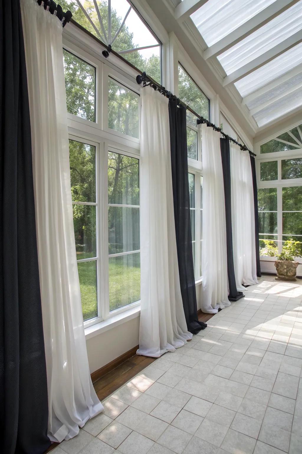 Layered curtains offer both light management and seclusion in your sunroom.