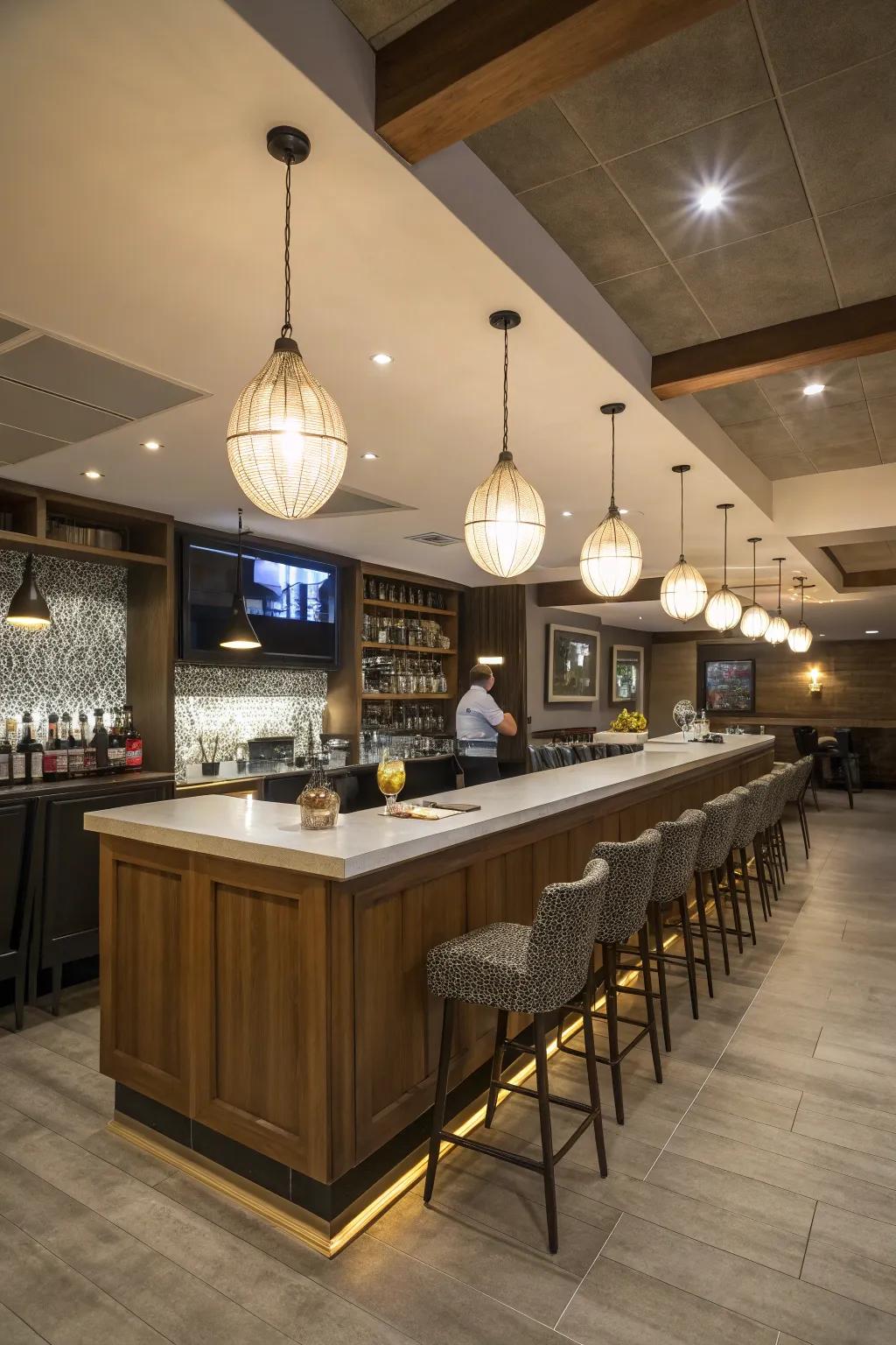 The basement bar area is enhanced with an air of refinement thanks to the elegant pendant lights.