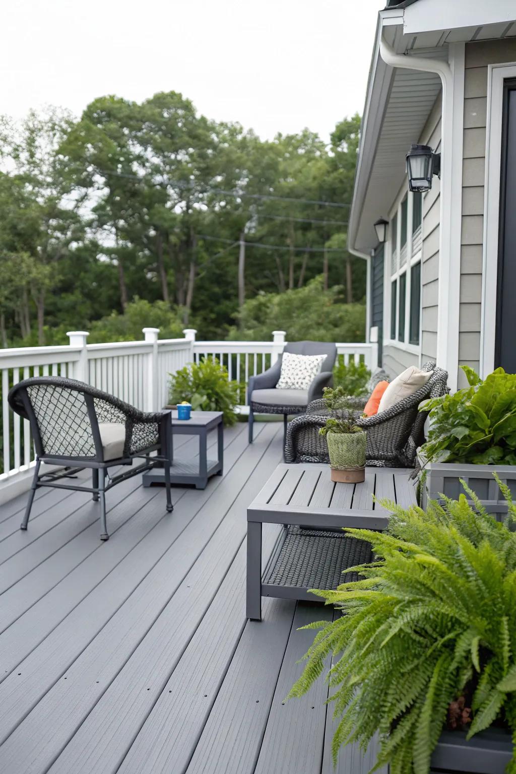 A contemporary gray deck harmoniously paired with fashionable outdoor furnishings.