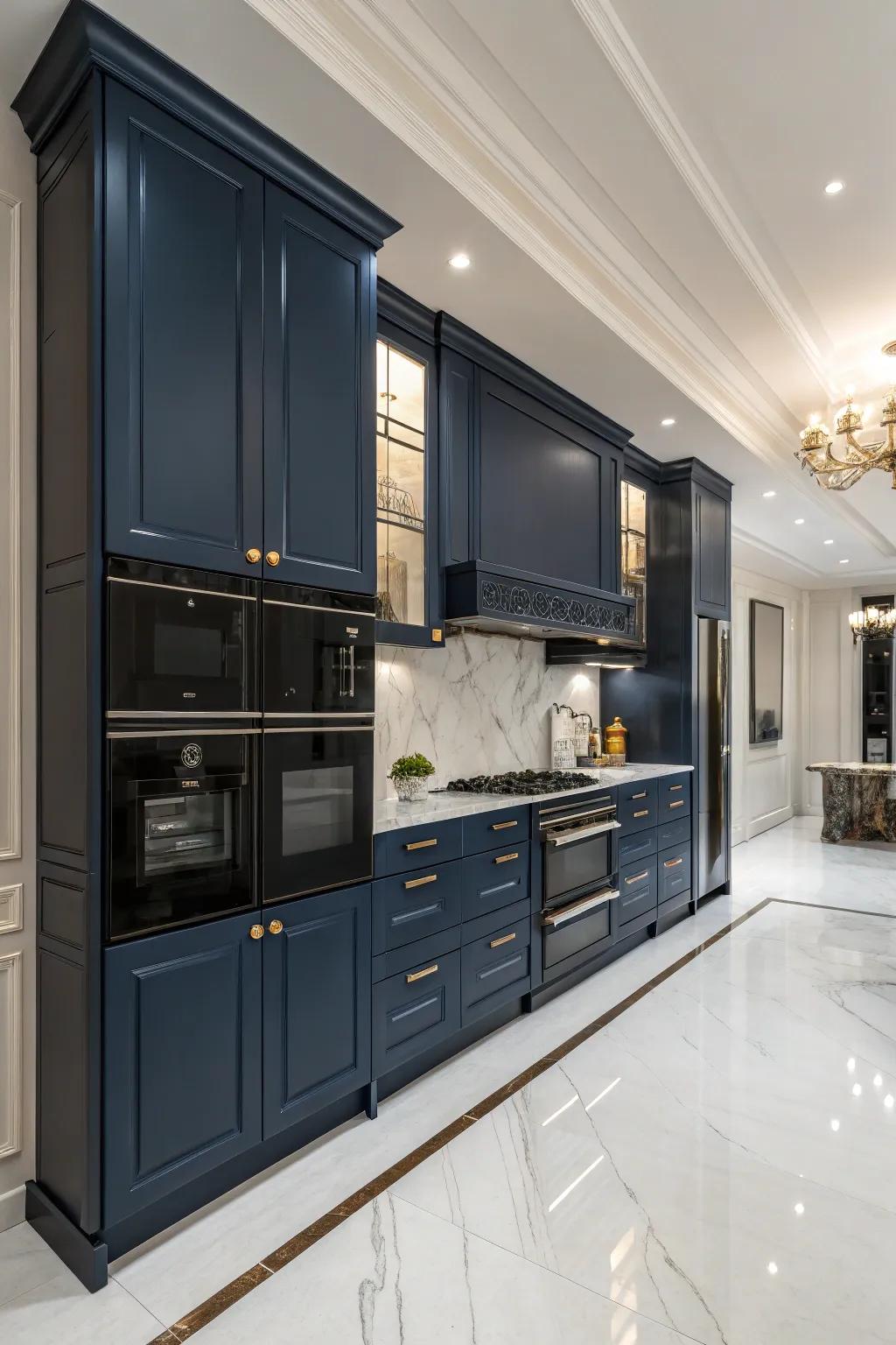 Indigo cabinets contribute a dramatic touch to sleek charcoal appliances.